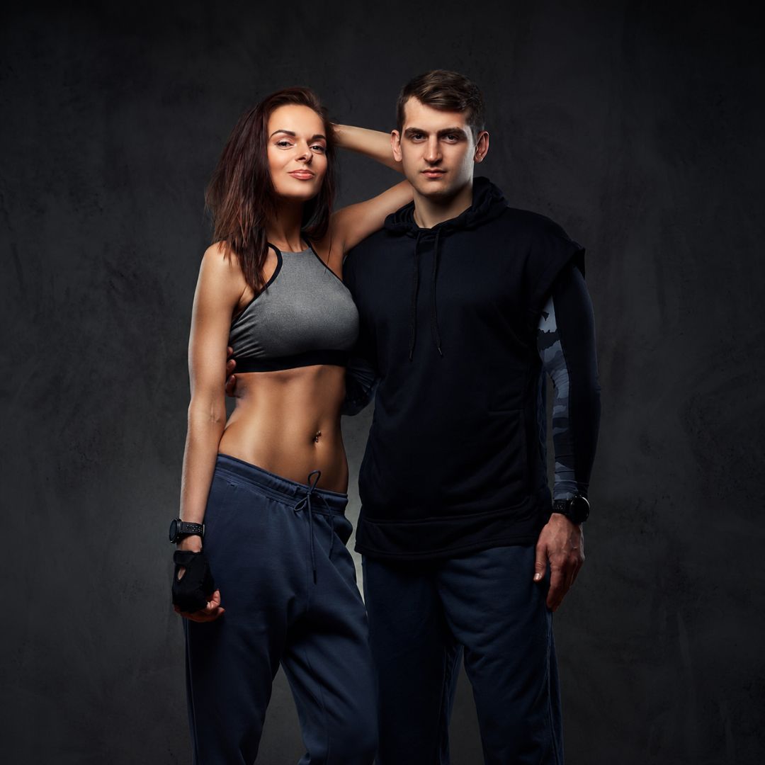 Athletic man and woman in workout apparel